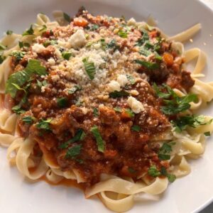 Pasta with bolognese sauce, parmesan and parsley