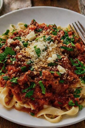 Pasta with bolognese sauce, parmesan and parsley