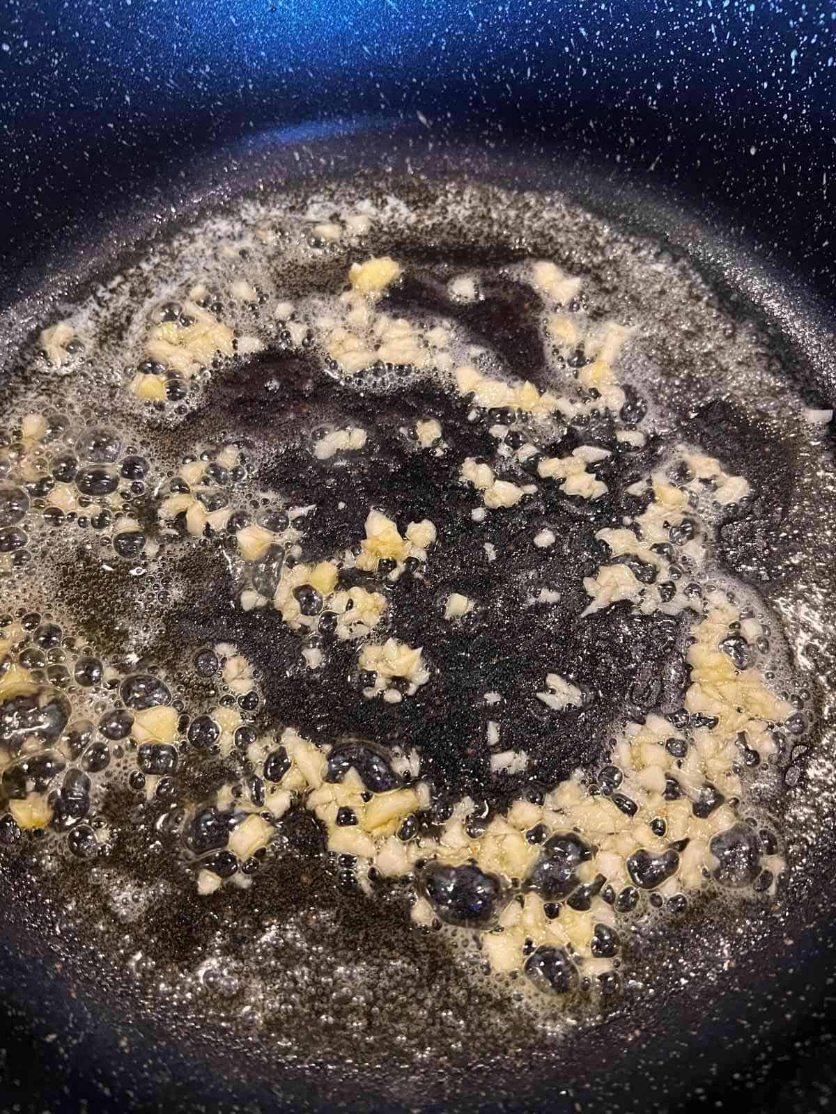 Garlic sauteing in butter and oil