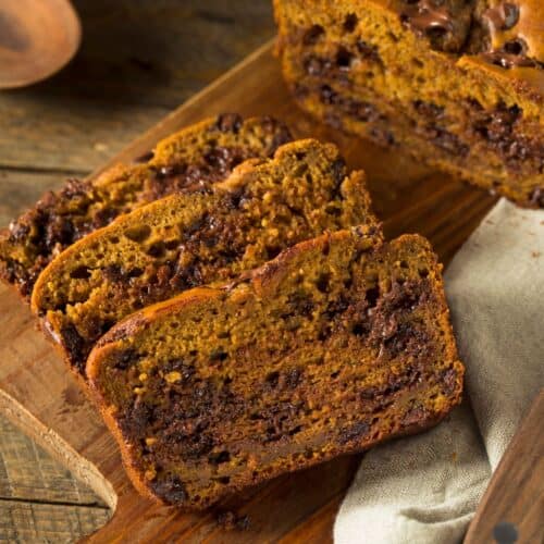 Finished pumpkin bread sliced on a cutting board