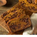 Finished pumpkin bread sliced on a cutting board