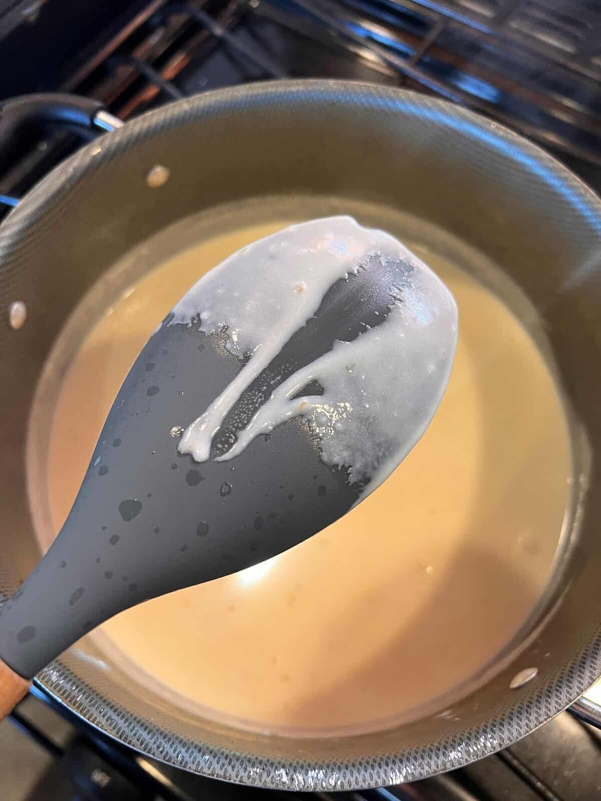 sauce coating the back of a spoon
