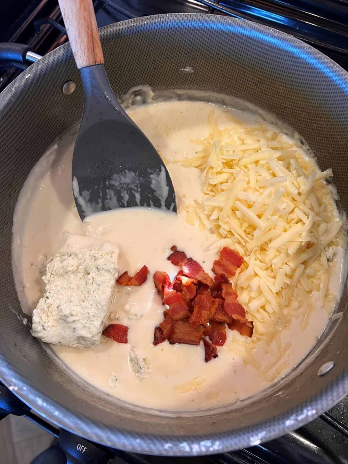 cheese and bacon added to sauce