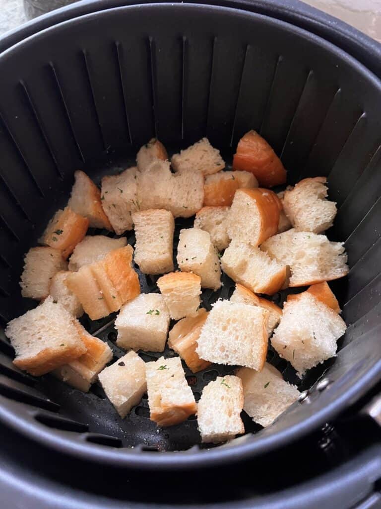 Bread cubes in the air fryer basket