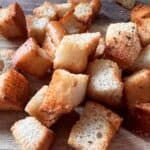 Close up of croutons cooling on a cutting board