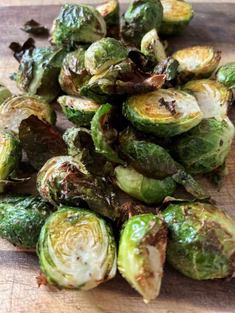 Charred sprouts on a cutting board