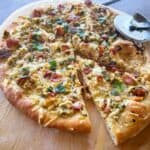White clam pizza with one slice cut