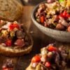 Olive tapenade on a board with crostini