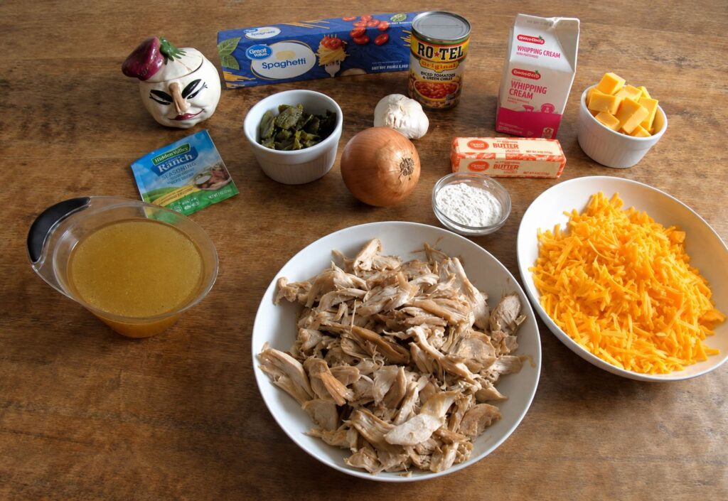 Ingredients for Texas Chicken Spaghetti laid out on a cutting board