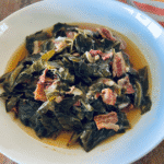 Finished collard greens in a white bowl