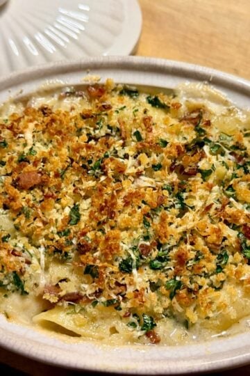 Golden baked lobster mac and cheese with a crisp breadcrumb topping