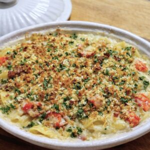 Golden baked lobster mac and cheese with a crisp breadcrumb topping